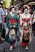 Group of women dressed as Maikos in the streets of Kyoto, Japan