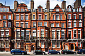 London, UK, May 2 2009, Colorful Victorian houses in red brick stand proudly along Pont Street in Kensington, reflecting classic London architecture and history.