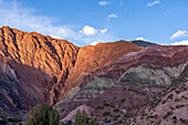 Striated rock layers in the Hill of Seven Colors or Cerro de los Siete Colores in Purmamarca, Argentina.