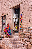 Souvenirs for sale in a shop in a traditional adobe brick building in Purmamarca, Argentina.