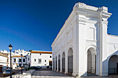 The Court of First Instance stands proudly in San Jose square, showcasing stunning whitewashed architecture against a clear blue sky.