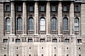 The Pergamon Museum in Berlin features a stunning architectural façade with grand columns and intricate window designs.