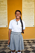 Portrait of young school girl in Quinta de San Pedro Alejandrino, where Simon Bolivar spent his last days, Santa Marta, Colombia