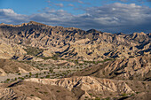 Route 40, an unpaved dirt road through the eroded landscape of the Angastaco Natural Monument in the Calchaqui Valley, Argentina.