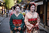 Group of women dressed as Maikos in the streets of Kyoto, Japan