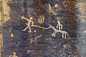 Two figures with a horse on an historic Ute Amerindian rock art panel in Nine Mile Canyon, Utah.