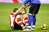 Seville, Spain, Feb 4 2009, Gorka Iraizoz assists his teammate Llorente, who is on the ground after a blow, during a knockout match in Sevilla.