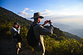 Hikers enjoying a beautiful sunset in Sierra Nevada de Santa Marta, Colombia