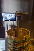 A vintage wooden grape press in the Museo de la Vid y el Vino or Museum of the Vine and the Wine in Cafayate, Argentina.