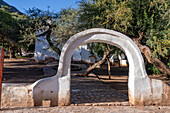 Arched gateway to the atrium of the Church of Santa Rosa de Lima in Purmamarca, Argentina.