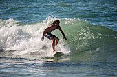 Surfers in Grande Plage beach of Biarritz, France