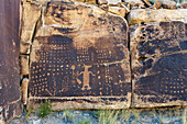 The Coyote Placing the Stars pre-Hispanic Fremont Amerindian rock art panel in Nine Mile Canyon, Utah. This panel may depict the Amerindian myth of how the coyote placed the stars in the sky.