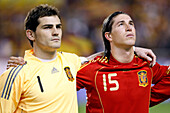 Seville, Spain, Feb 11 2009, Iker Casillas and Sergio Ramos stand together, embracing as their national anthem plays before a match in Seville on February 11, 2009.