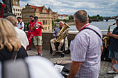 Street musicians playing on Charles Bridge, Prague