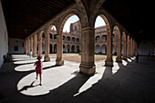 Salamanca, Spain, Aug 17 2008, A child runs through the cloisters arches while visitors explore the historic Colegio Arzobispo Fonseca in Salamanca.