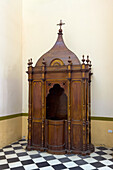 A carved wooden confessional booth in the Cathedral of Our Lady of the Rosary in Cafayate, Salta Province, Argentina.