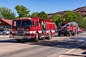 A fire engine sprays water at the crowd in the Fourth of July Parade on Independence Day in Moab, Utah.