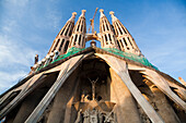 The Sagrada Familia showcases intricate towers and sculpted facades in Barcelona, highlighting Gaudís unique architectural vision.