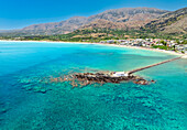 Aerial drone photo of Georgioupoli and famous chapel of Agios Nikolaos built at sea with a small path connecting to mainland, Chania, Crete island, Greek Islands, Gteece, Europe