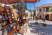 View of souvenirs, clock tower of Greek Orthodox Church and restaurant, Theologos, Thassos, Aegean Sea, Greek Islands, Greece, Europe