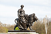 Bronze figure of Agriculture supported by a bronze lion, Victoria Memorial, The Mall, London, England, United Kingdom, Europe