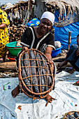 Woman selling fish on a Market, Mbandaka, Equateur province, Democratic Republic of Congo, Africa