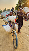 Man with a loaded bicycle on the very bad road between Tshikapa and Kananga, Kasai, Democratic Republic of Congo, Africa