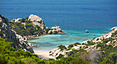 View from rocky hillside over the calm turquoise waters of Cala Napoletana, Caprera Island, La Maddalena Archipelago National Park, Sassari, Sardinia, Italy, Mediterranean, Europe