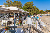 View of restaurants and cafes overlooking beach at Limenaria, Limenaria, Thassos, Aegean Sea, Greek Islands, Greece, Europe