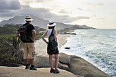 Woman and man admiring the beaches of Arrecifes, Tayrona National Natural Park, Department of Magdalena, Caribbean Region, Colombia, South America