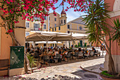 View of cafe restaurant in Plakada t' Agiou Spiridona Square, Corfu Old Town, UNESCO World Heritage Site, Corfu, The Ionian Islands, Greek Islands, Greece, Europe