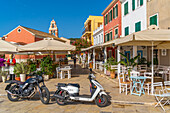 View of cafes and restaurants in Gaios Plaza de l' Ascension in Gaios Town, Paxos, Ionian Sea, Greek Islands, Greece, Europe