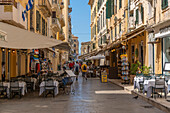 View of shops and cafes in narrow street, Corfu Town, Corfu, Ionian Sea, Greek Islands, Greece, Europe