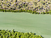 A view of the Mitchell River meandering towards Swift Bay as seen from a commercial helicopter, Kimberley, Western Australia, Australia, Pacific