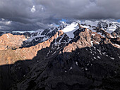 Snow-capped peaks and lush valleys at sunset showcased in a stunning landscape, Kyrgyzstan, Central Asia, Asia