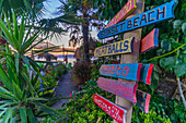 View of signpost on beach after sunset, Thassos Town, Thassos, Aegean Sea, Greek Islands, Greece, Europe