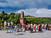 People eating al fresco at Avon Gorge by Hotel du Vin, Clifton Suspension Bridge in the background, Bristol, England, United Kingdom, Europe