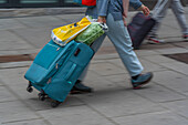 View of people with roller suitcases heading for Central Station, Oslo, Norway, Scandinavia, Europe