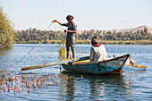 Net fishermen in rowing boat, village of Ramadi, west bank of the Nile south of Edfu, Egypt, North Africa, Africa