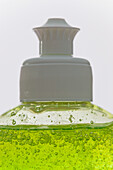 Close up of a bottle of dishwashing detergent