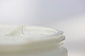 Close up of a jar full of moisturizer