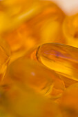 Extreme close up of cod liver oil pills