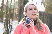 Teenage Girl Holding Camera