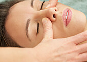 Woman Receiving a Facial Massage, Close-up View