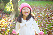 Smiling Young Girl In Park