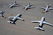 High angle view airplanes parked on sunny airport tarmac