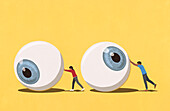 Couple pushing large eyeballs on yellow background