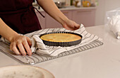 Freshly baked cake cools on a kitchen counter