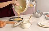 Baking a cake in a cosy living room kitchen