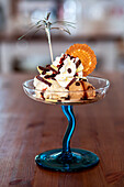 Gourmet ice cream sundae in elegant glass dish